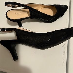 Dressy black dress shoe with strap and 2 inch heel